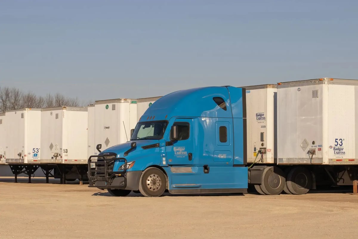 Dry van semi-truck on highway — full truckload FTL shipping